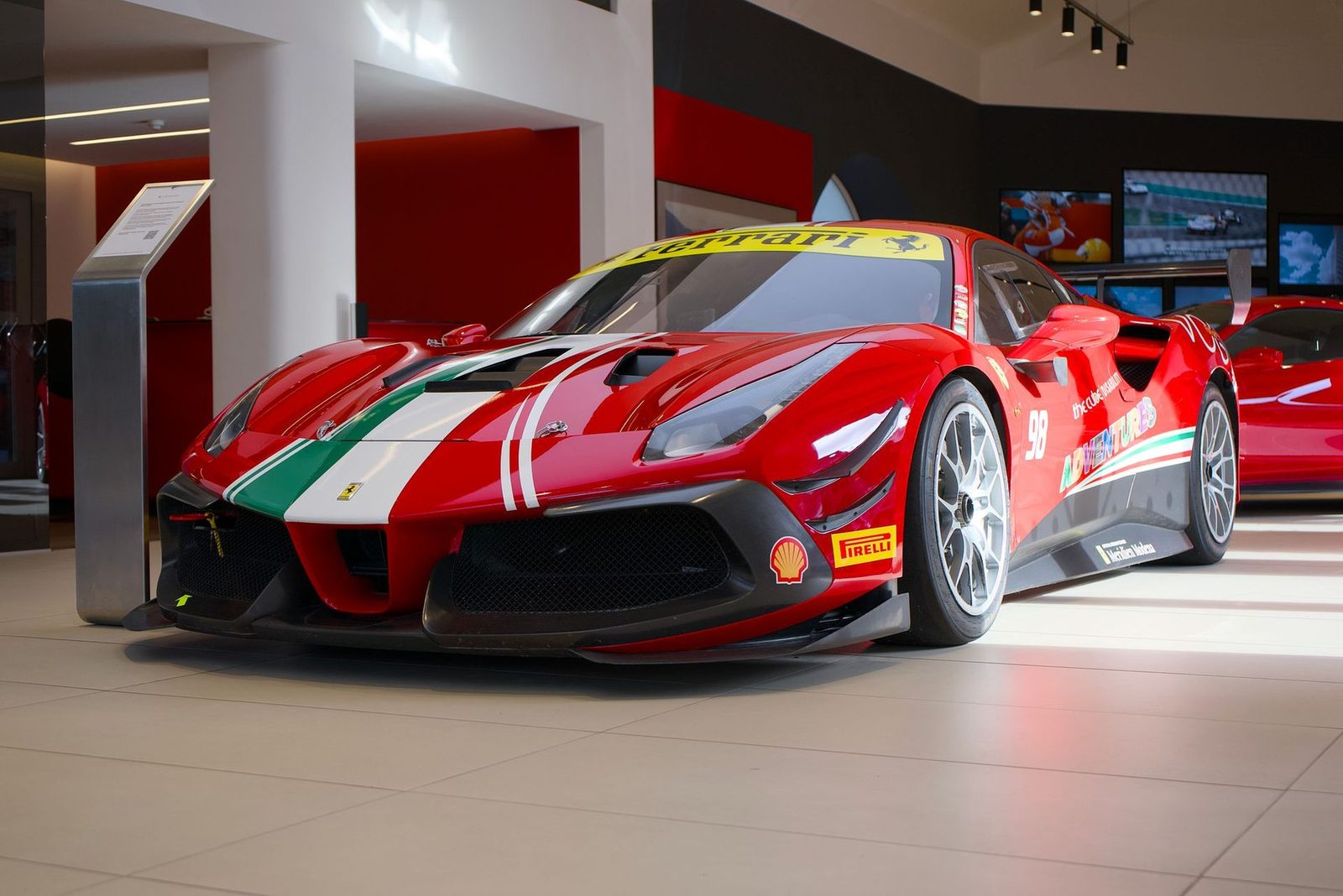Ferrari 488 Challenge race car on a showroom floor